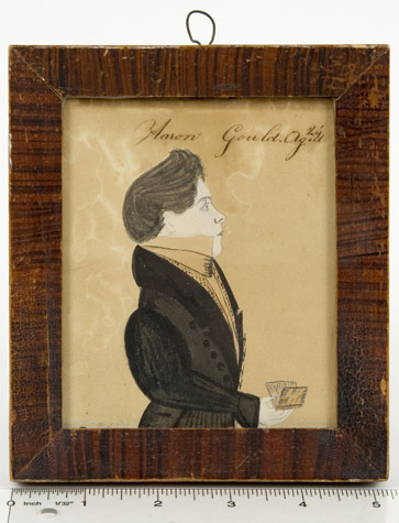 Amos Holbrook, Miniature Portrait of Aaron Gould, Aged 24, New Hampshire, Circa 1830
         Portrait of Aaron Gould, small half-length, in a black coat, holding a book Inscribed Aaron  
         Gould.Ag.d/24 [sic] along the upper edge, ruler view